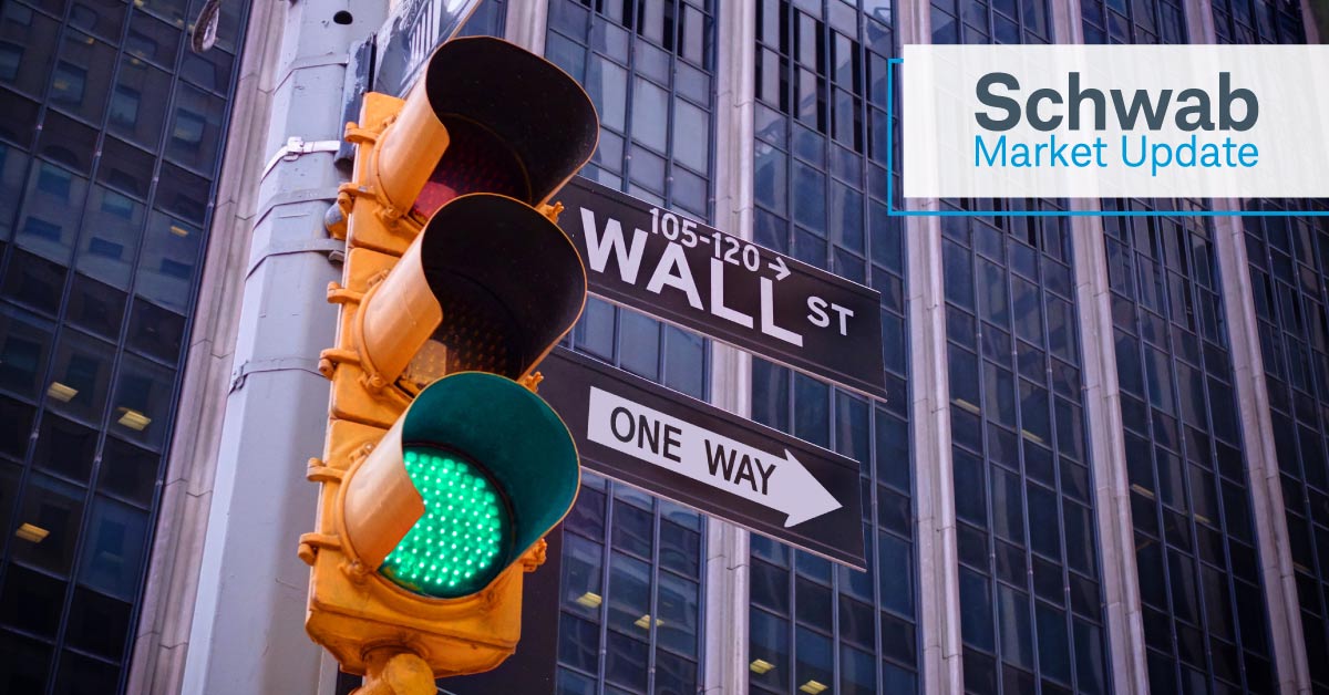 Schwab Market Update: Traffic light and Wall St. street sign.