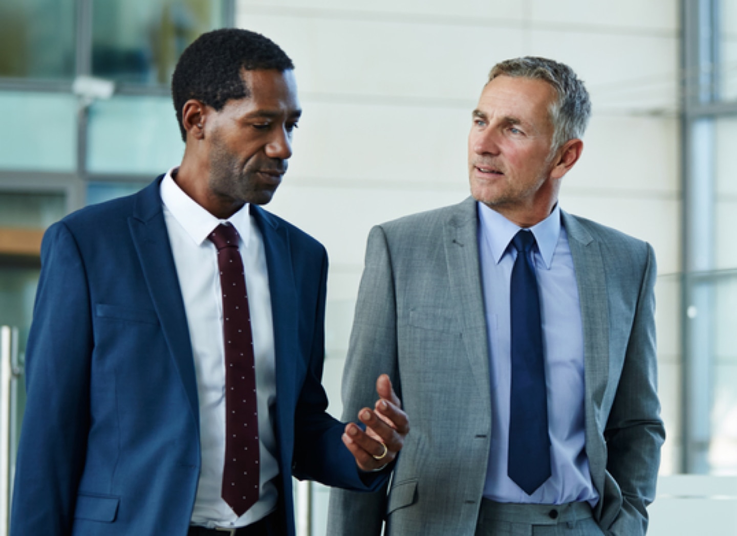 Two men walking and talking